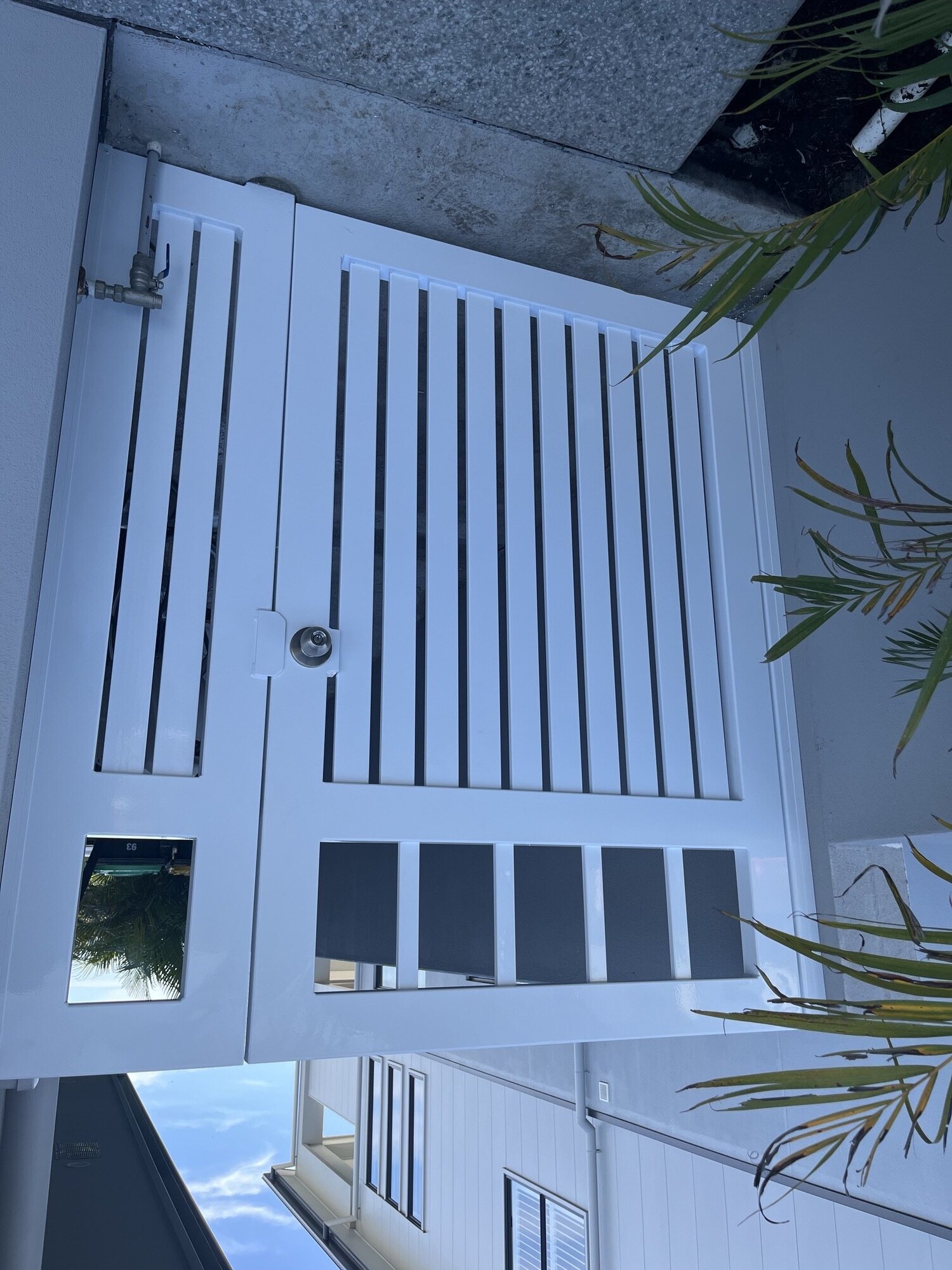 White louvre pedestrian gate with lock